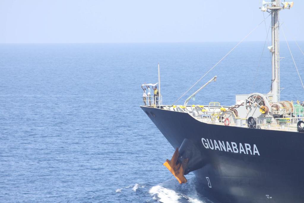 Arabian Sea (Mar. 6, 2011) Suspected pirates indicate their surrender on the bow of Japanese-owned commercial oil tanker M/V Guanabara. Combined Maritime Forces warship USS Bulkeley (DDG 84), with support from Turkish warship TCG Giresun of NATO’s counter-piracy Task Force 508 responded to the reported pirating of Guanabara, which resulted in the detention of the four suspected pirates and freeing of 24 crew members.  © SW